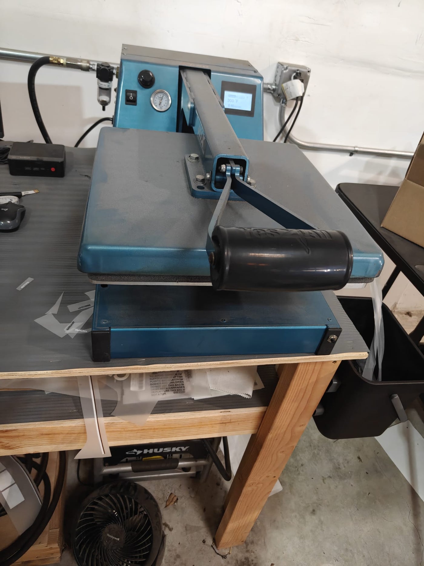 A heat press in action at the MugOnAMug shop